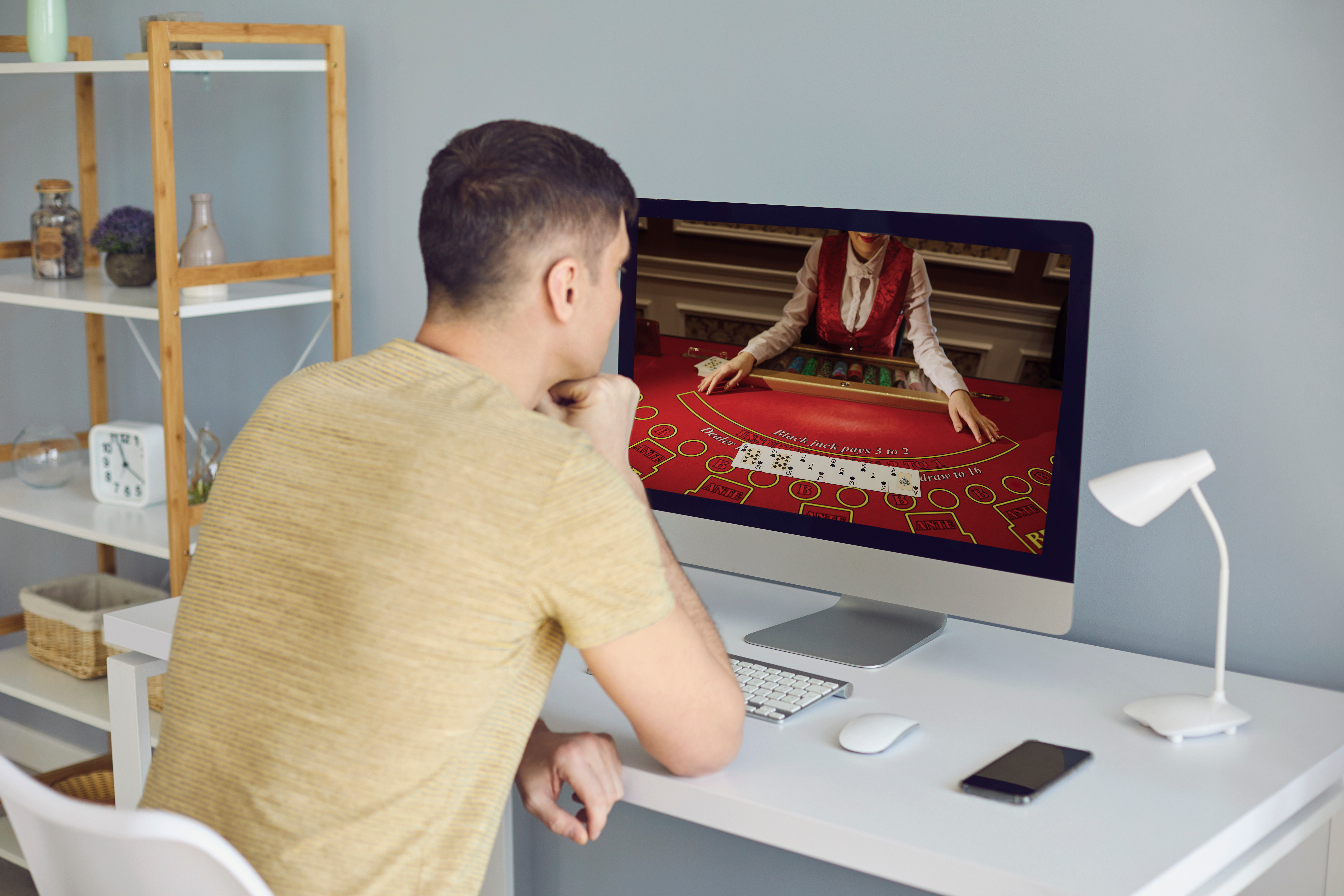 Online casino. A man makes bets online casino video chat casino cards poker roulette Online casino. A man makes bets online casino video chat casino cards poker roulette