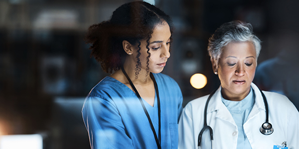 Women, doctors and tablet for night medical research, surgery planning and teamwork in hospital. Nurse, healthcare and worker collaboration on technology in late shift for wellness thinking and ideas