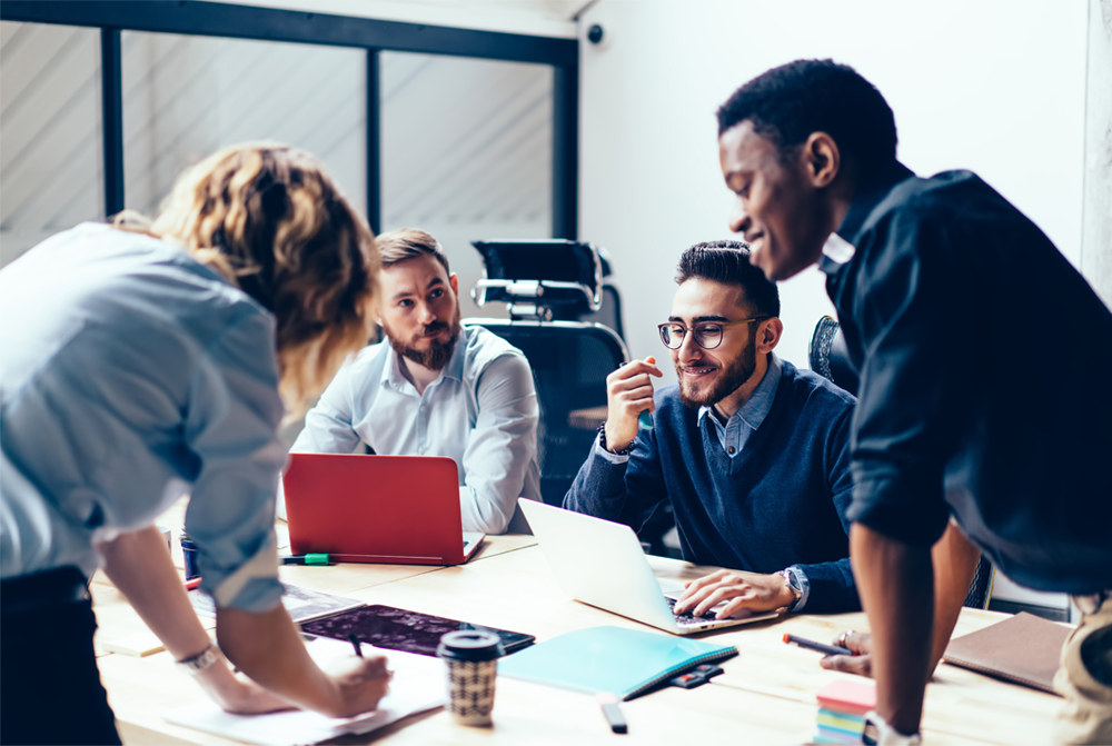 Group of marketing professionals collaborate on a project Group of marketing professionals collaborate on a project