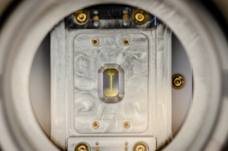 Figure 2. A close-up of an ion trap mounted inside an IonQ QPU Figure 2. A close-up of an ion trap mounted inside an IonQ QPU