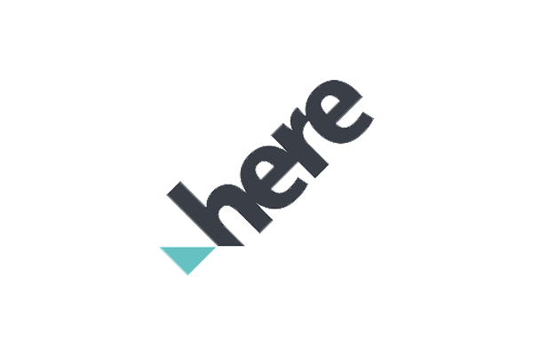 Logo of "here" with a teal geometric shape in the bottom left corner.