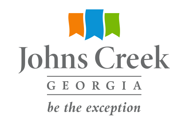 Logo of Johns Creek, Georgia featuring three colorful banners above the city name and the slogan 'be the exception' underneath.