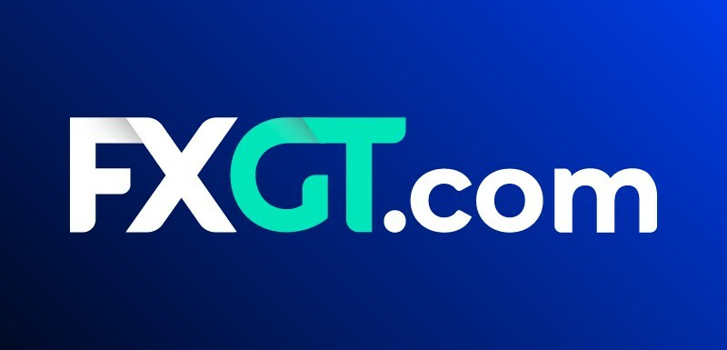 The logo of FXGT.com featuring the brand name in white and teal letters on a blue gradient background.